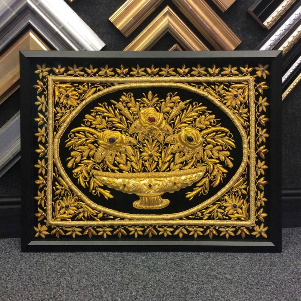 A simple yet sophisticated black frame is all that is needed to complement this vibrant piece of intricate work