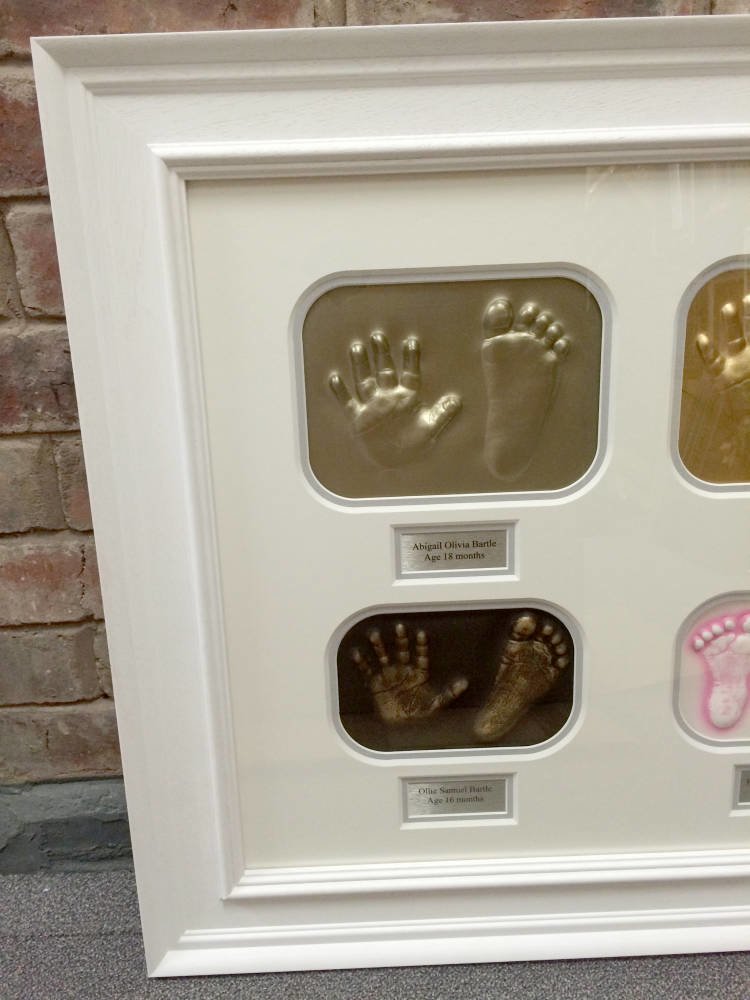 Baby feet and hands framed