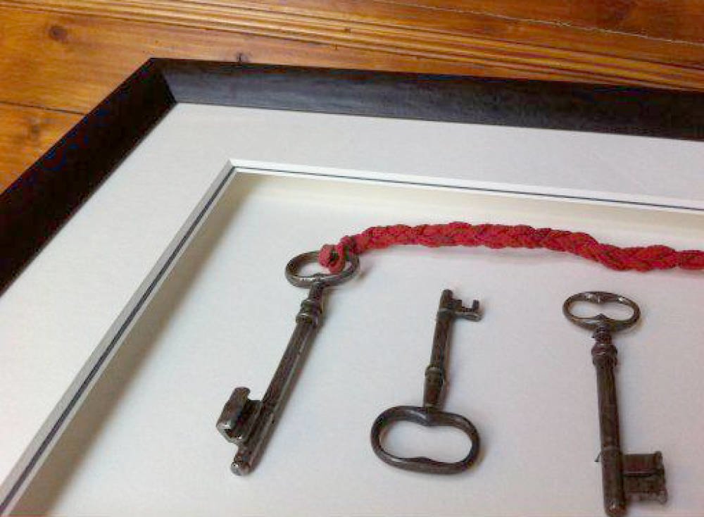 Set of antique keys framed