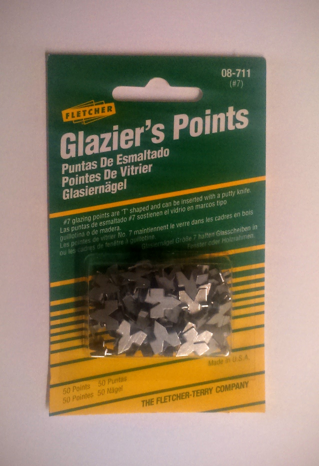 Buy packs of Glaziers Push Points to hold artwork in a frame